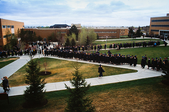 Graduates march into the Hart building during the processional.
