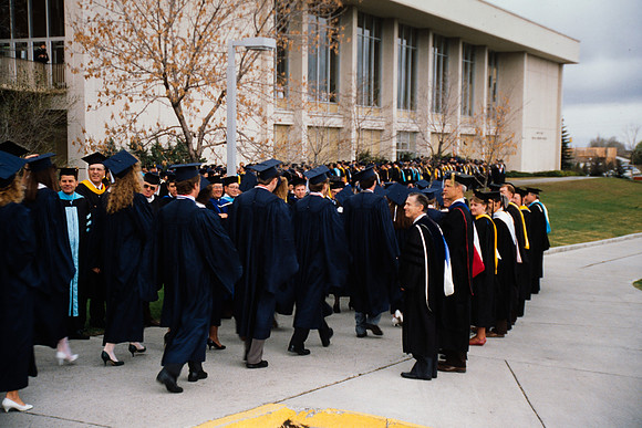 Graduates march into the Hart building during the processional.