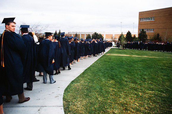 Graduates march into the Hart building during the processional.