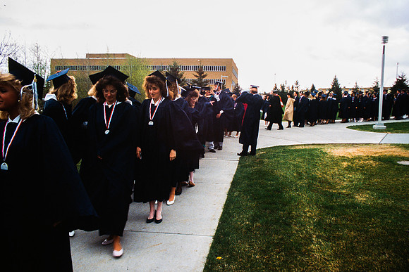 Graduates march into the Hart building during the processional.