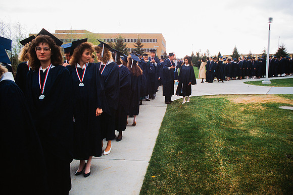Graduates march into the Hart building during the processional.