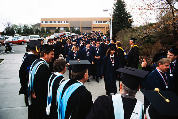 Graduates march into the Hart building during the processional.