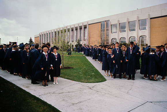 Graduates march into the Hart building during the processional.