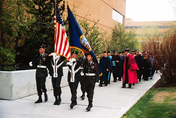 Graduates march into the Hart building during the processional. ROTC Color Guard