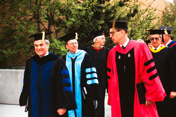 Graduates march into the Hart building during the processional. Pres. Christensen, Elder Henry B. Eyring