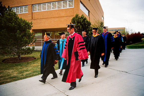 Graduates march into the Hart building during the processional. Pres. Christensen, Elder Henry B. Eyring