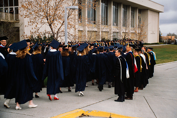 Graduates march into the Hart building during the processional.
