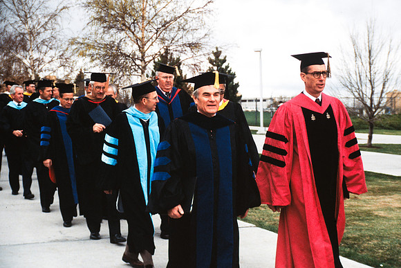 Graduates march into the Hart building during the processional. Pres. Christensen, Elder Henry B. Eyring