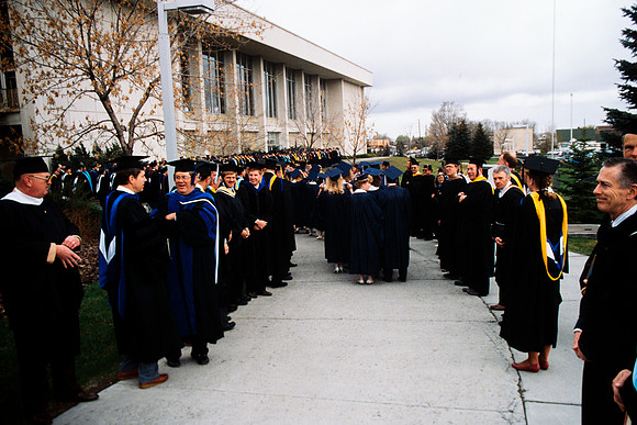 Graduates march into the Hart building during the processional.