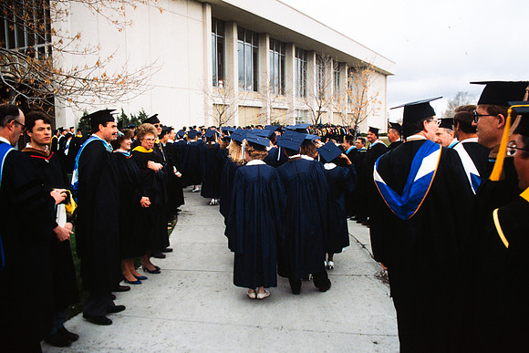 Graduates march into the Hart building during the processional.