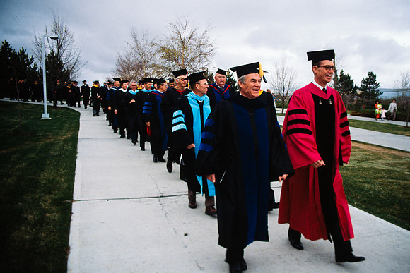 Graduates march into the Hart building during the processional. Pres. Christensen, Elder Henry B. Eyring