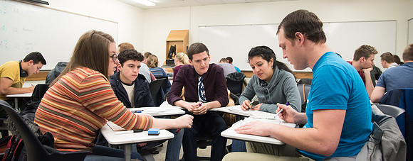 Group problem-solving in Brother Kelson's biology class.