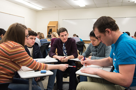 Group problem-solving in Brother Kelson's biology class.
