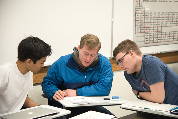 Group problem-solving in Brother Kelson's biology class.