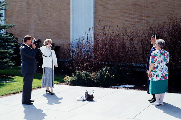 Rick's College graduate taking pictures