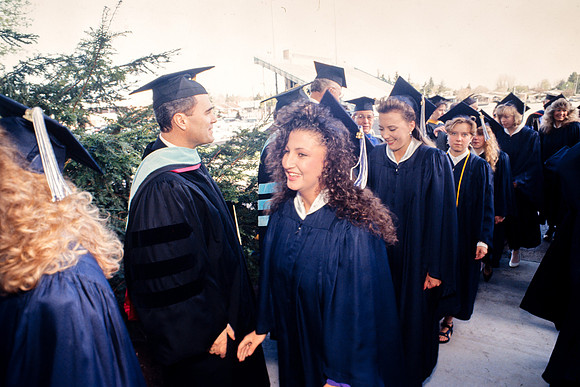 President Bennion shaking graduates' hands