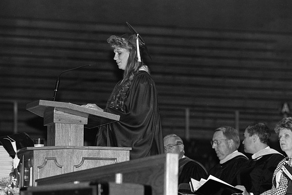 Rick's College graduate at the podium