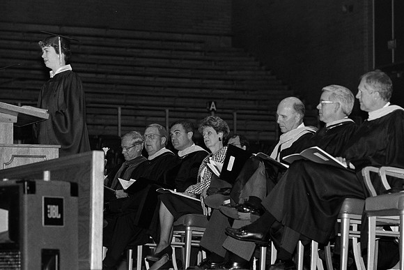 Rick's College graduate at the podium
