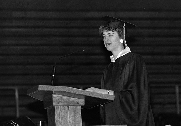 Rick's College graduate at the podium
