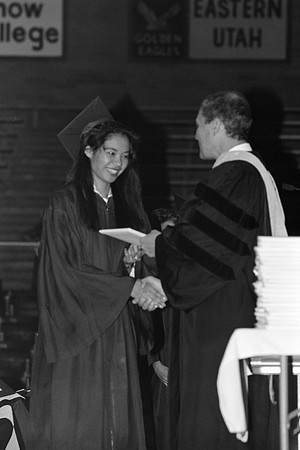 President Bennion handing diplomas