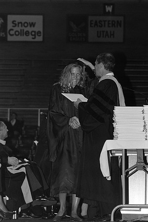 President Bennion handing diplomas