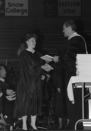 President Bennion handing diplomas
