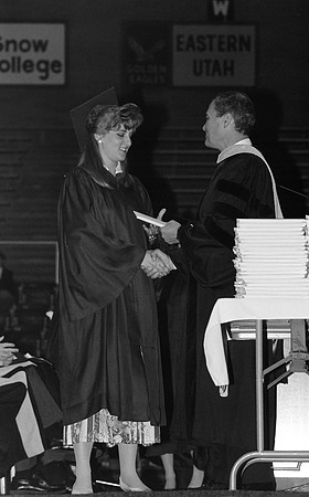 President Bennion handing diplomas