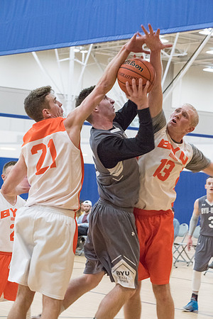 Men's competitive basketball teams play in their final games before tournament.