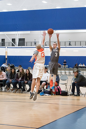 Men's competitive basketball teams play in their final games before tournament.