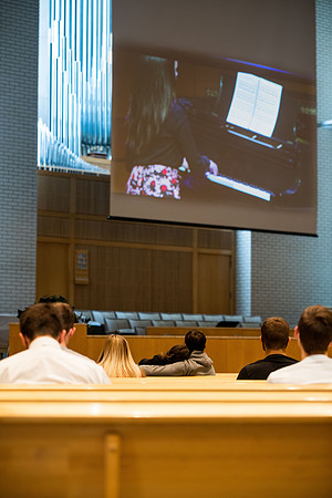 BYUI students watch sister Susan Orme's devotional in the Taylor chapel during spirit week.