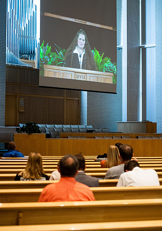 BYUI students watch sister Susan Orme's devotional in the Taylor chapel during spirit week.