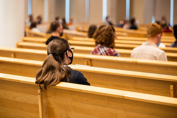 BYUI students watch sister Susan Orme's devotional in the Taylor chapel during spirit week.