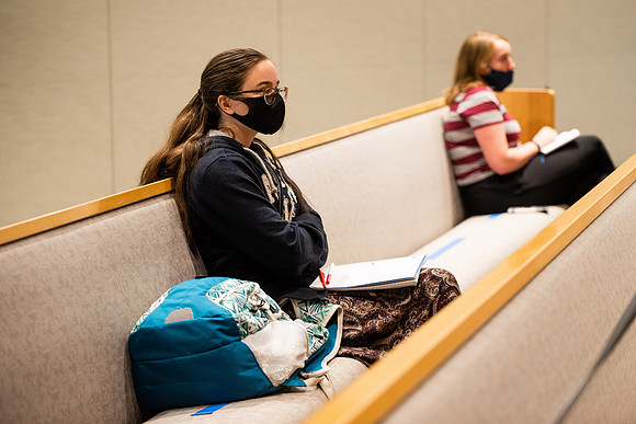 BYUI students watch sister Susan Orme's devotional in the Taylor chapel during spirit week.