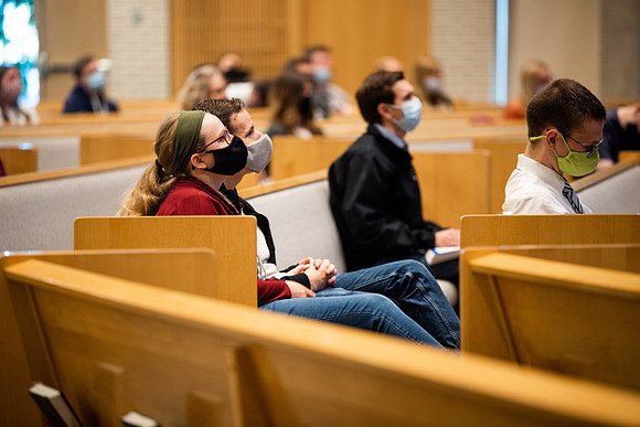 BYUI students watch sister Susan Orme's devotional in the Taylor chapel during spirit week.