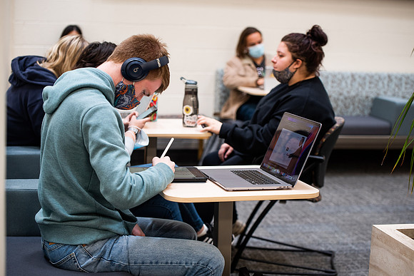 BYUI students watch sister Susan Orme's devotional in the Taylor chapel during spirit week.