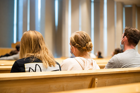 BYUI students watch sister Susan Orme's devotional in the Taylor chapel during spirit week.