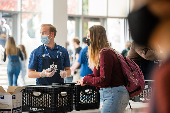 BYUI students and faculty gather by the I-Center after devotional and eat Reed's dairy ice cream to celebrate spirit week.