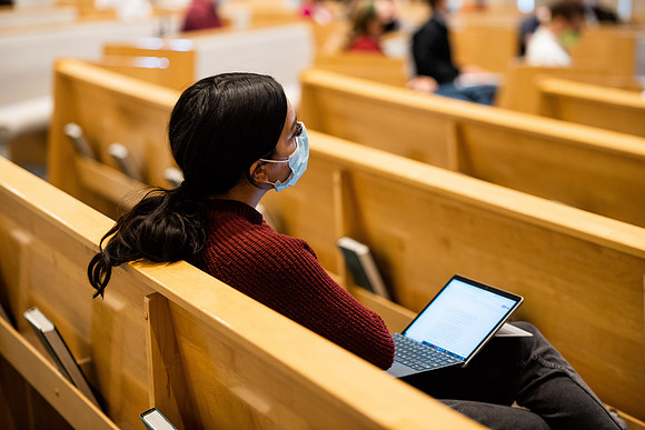 BYUI students watch sister Susan Orme's devotional in the Taylor chapel during spirit week.