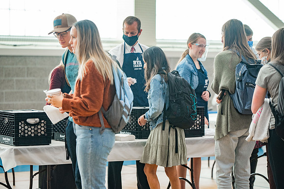 BYUI students and faculty gather by the I-Center after devotional and eat Reed's dairy ice cream to celebrate spirit week.