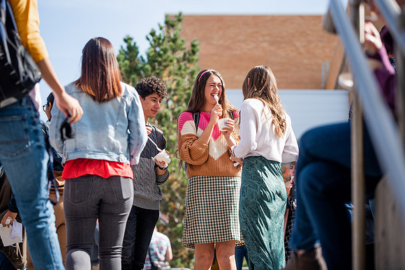 BYUI students and faculty gather by the I-Center after devotional and eat Reed's dairy ice cream to celebrate spirit week.