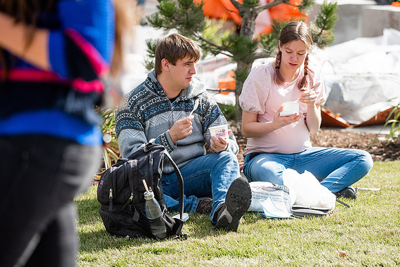BYUI students and faculty gather by the I-Center after devotional and eat Reed's dairy ice cream to celebrate spirit week.