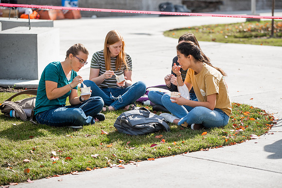 BYUI students and faculty gather by the I-Center after devotional and eat Reed's dairy ice cream to celebrate spirit week.
