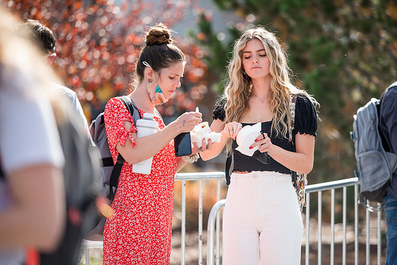 BYUI students and faculty gather by the I-Center after devotional and eat Reed's dairy ice cream to celebrate spirit week.