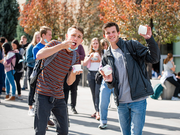 BYUI students and faculty gather by the I-Center after devotional and eat Reed's dairy ice cream to celebrate spirit week.