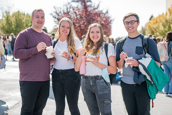 BYUI students and faculty gather by the I-Center after devotional and eat Reed's dairy ice cream to celebrate spirit week.
