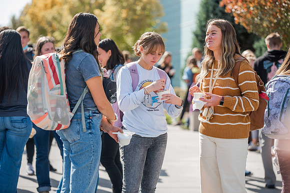BYUI students and faculty gather by the I-Center after devotional and eat Reed's dairy ice cream to celebrate spirit week.