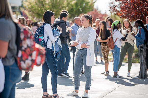 BYUI students and faculty gather by the I-Center after devotional and eat Reed's dairy ice cream to celebrate spirit week.