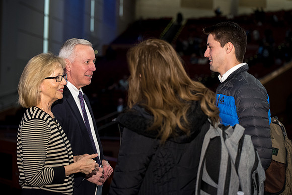 Elder Kevin S. Hamilton, and Sister Hamilton talk to students after the devotional.