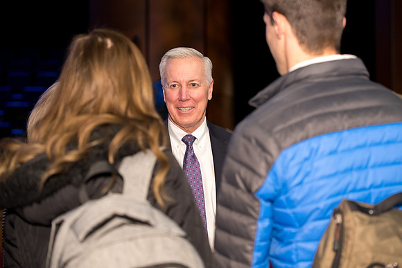 Elder Kevin S. Hamilton, and Sister Hamilton talk to students after the devotional.