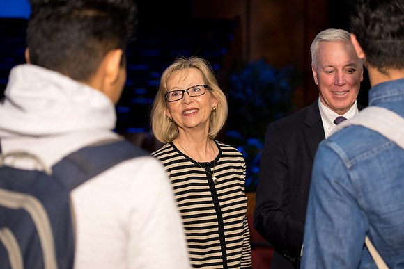 Elder Kevin S. Hamilton, and Sister Hamilton talk to students after the devotional.